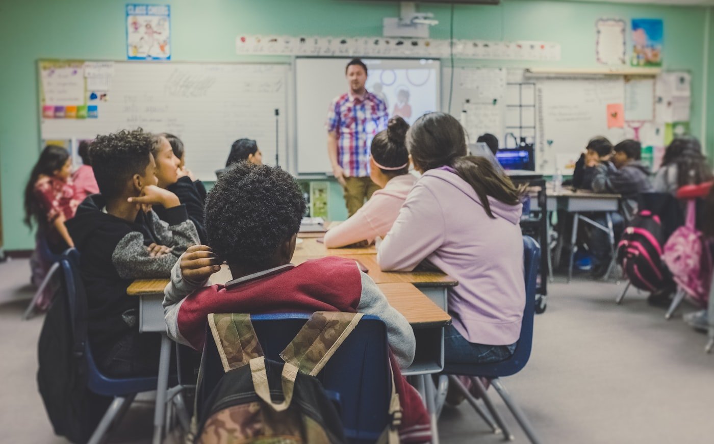 Students learning with teacher
